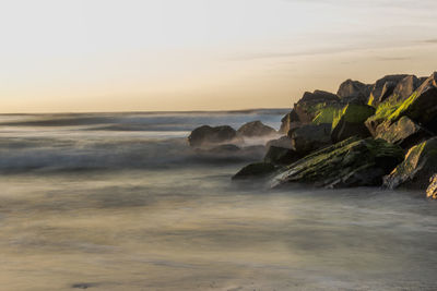 Scenic view of sea against sky during sunset