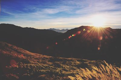 Scenic view of mountains against sky during sunset