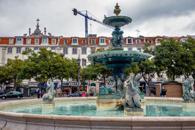Rossio christmas food traditional market and fountain. lisbon portugal