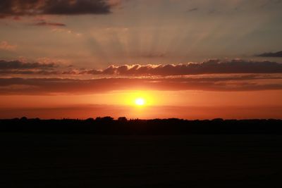 Scenic view of silhouette landscape against sky during sunset