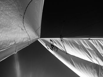 Low angle view of boat canvas against sky