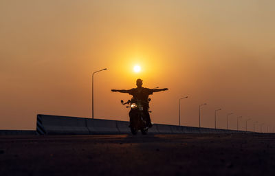 Young man riding big bike motocycle on asphalt high way against, motorbike man has freedom