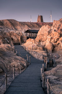 View of bridge over mountain against sky