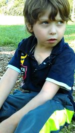 Close-up of boy in grass