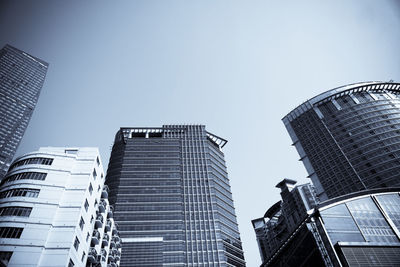 Low angle view of modern buildings against sky in city