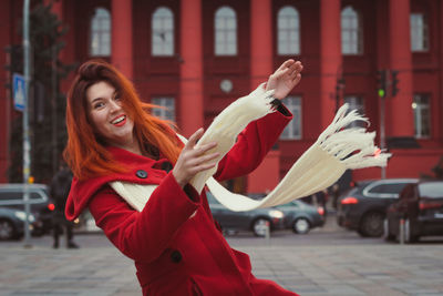 Close up joyful woman with long scarf on street portrait picture