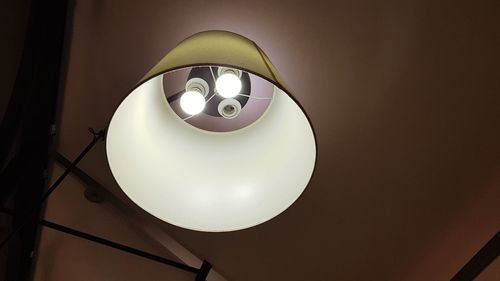 Low angle view of illuminated lamp