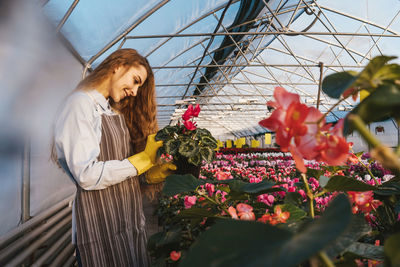 Woman standing in greenhouse