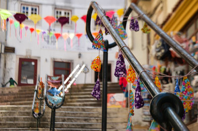 Close-up of multi colored clothes hanging on built structure