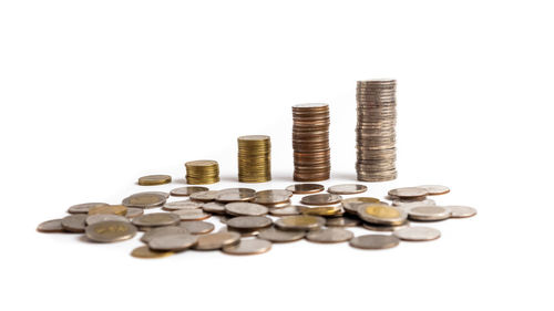 Close-up of coins on white background