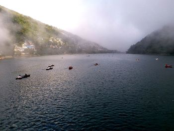 Scenic view of lake and mountains against sky