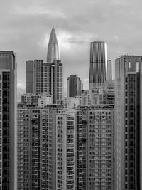 Modern buildings in city against sky