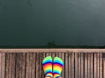 Rainbow over lake against sky
