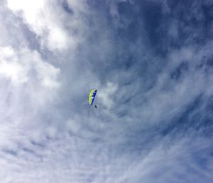 Low angle view of kite flying in sky