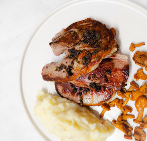 High angle view of meat in plate on table