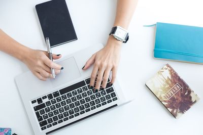 Midsection of woman using mobile phone
