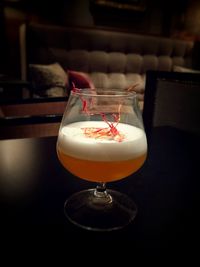 Close-up of wine glass on table