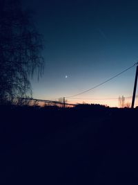 Scenic view of silhouette landscape against clear sky at sunset