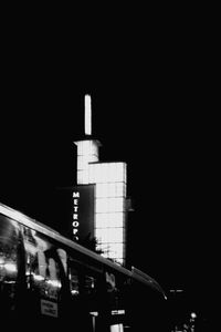 Illuminated building against clear sky at night