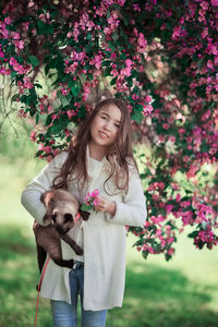 Portrait of woman with pink flowers