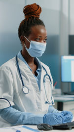 Doctor examining patient in laboratory