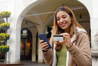 Young woman using mobile phone