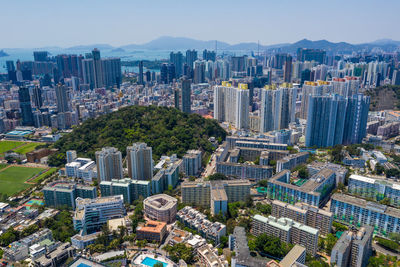 High angle view of modern buildings in city against sky