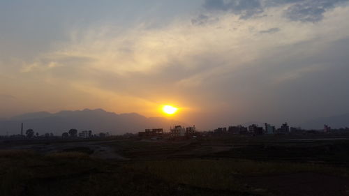 Scenic view of landscape against sky during sunset