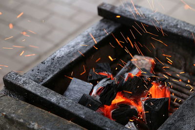 High angle view of burning charcoal