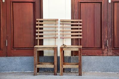 Empty chairs and table outside building