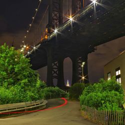 Illuminated city against sky at night