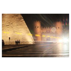 Digital composite image of illuminated building in city