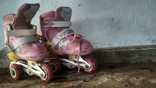 Close-up of shoes on wall