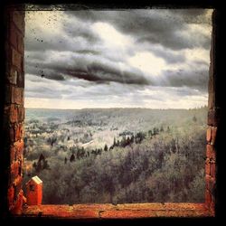 View of landscape against cloudy sky