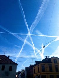 Low angle view of vapor trails in sky