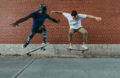 Full length of man running on skateboard