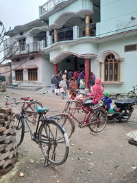 Bicycles on street against buildings in city