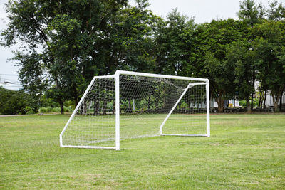 View of soccer field against trees
