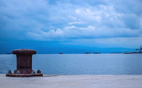 Scenic view of sea against cloudy sky