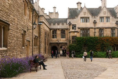 People in front of buildings