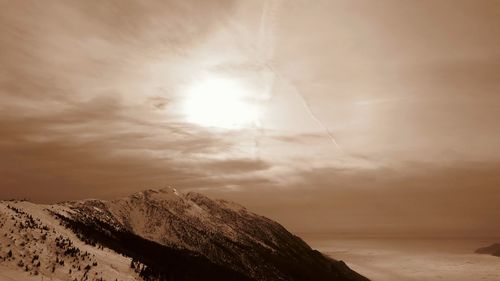 Scenic view of snow against sky during sunset