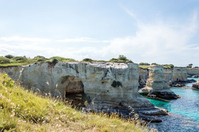 Panoramic shot of rocks on land against sky