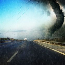 View of road against cloudy sky