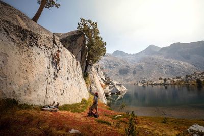 High angle view of people on lake against mountains