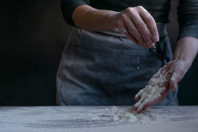 Midsection of man preparing food