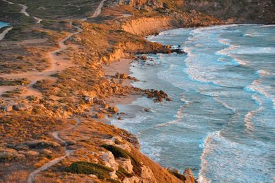 High angle view of rocks in sea