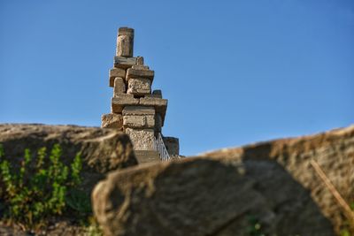 Low angle view of historic building against clear blue sky