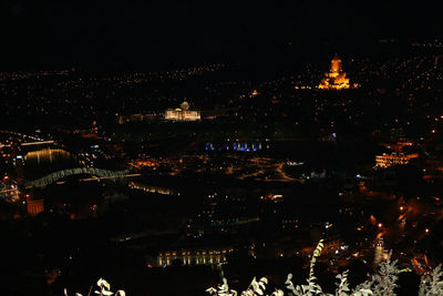 Illuminated buildings in city at night