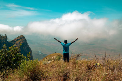 Ahiker at a scenic lookout at kwa mkeka peak on the usambara mountains in tanga region, tanzania