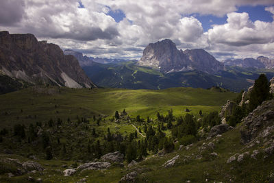 Scenic view of dolomites mountains against cloudy sky